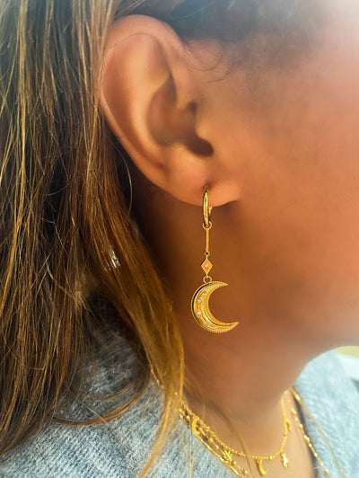 Model wearing statement gold bar moon drop hoop earring with CZ crystals