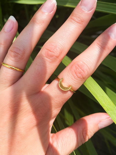 Model wearing gold plated sterling silver engraved moon ring