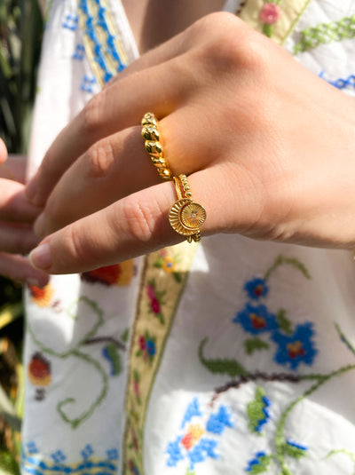 Model wearing gold plated sterling silver moon and star filigree ring with engraved moon and sun ring set 