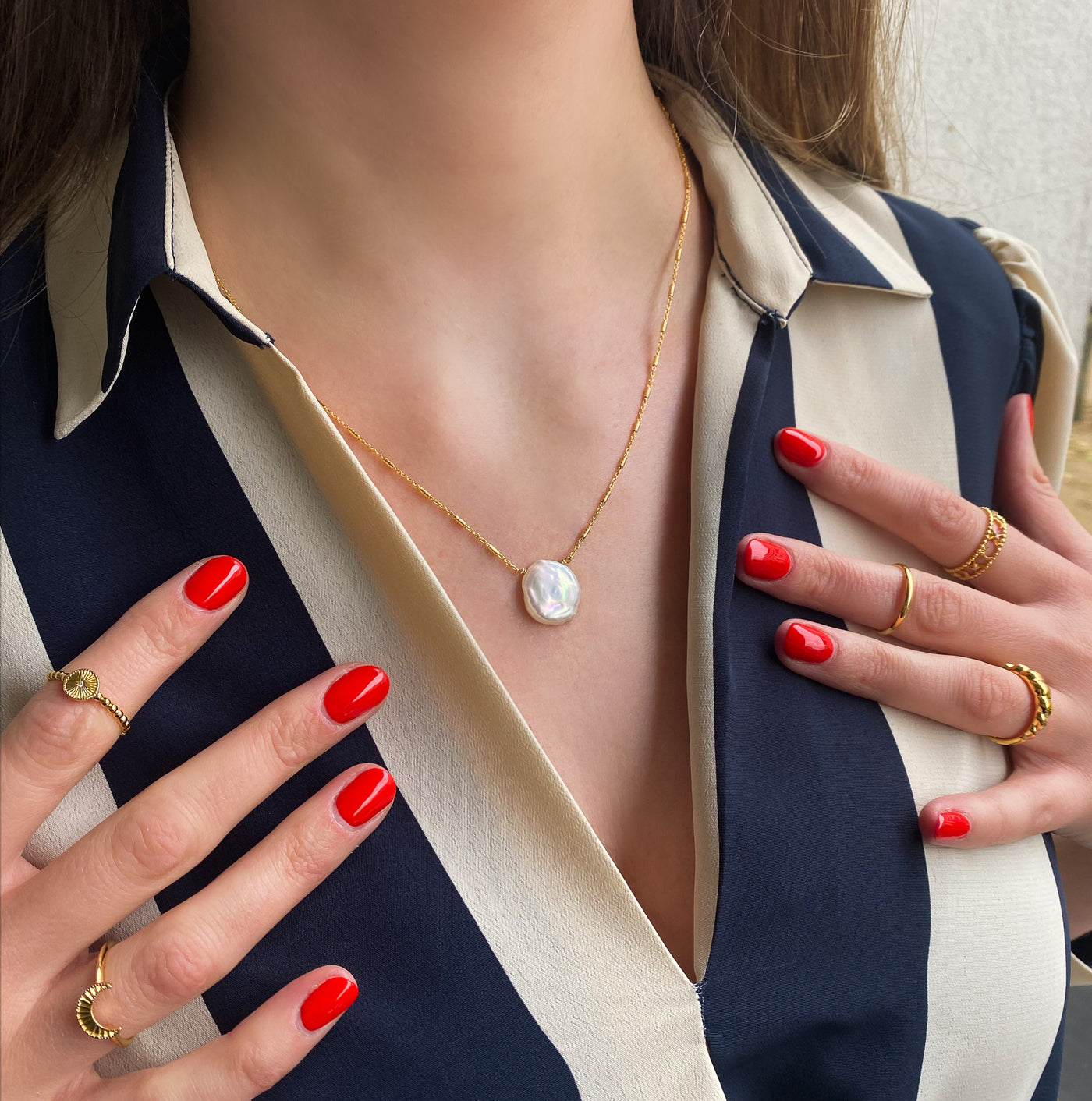 Model wearing gold plated sterling silver freshwater pearl necklace