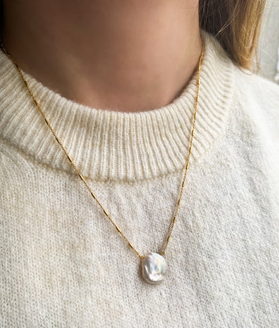 Model wearing gold plated sterling silver freshwater pearl necklace