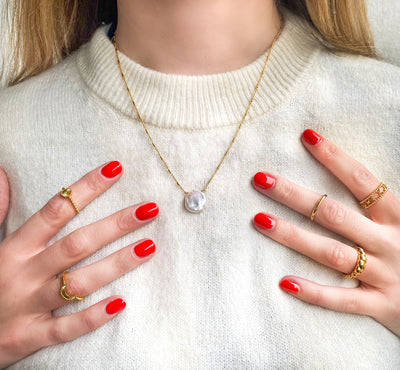 Model wearing gold plated sterling silver freshwater pearl necklace