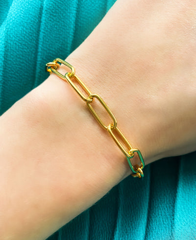 Model wearing gold plated sterling silver chunky chain bracelet