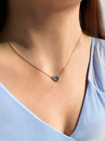 Bridesmaid wearing sterling silver heart knot bridesmaid necklace