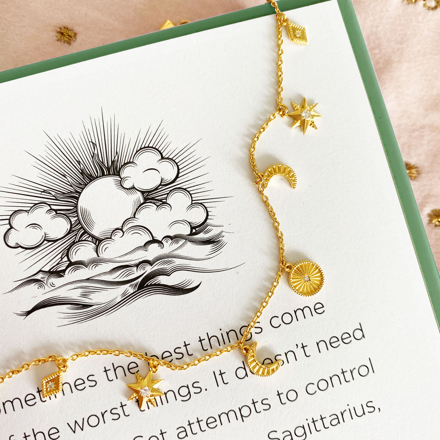Gold plated sterling Silver moon and star charm bracelet with CZ crystals on book