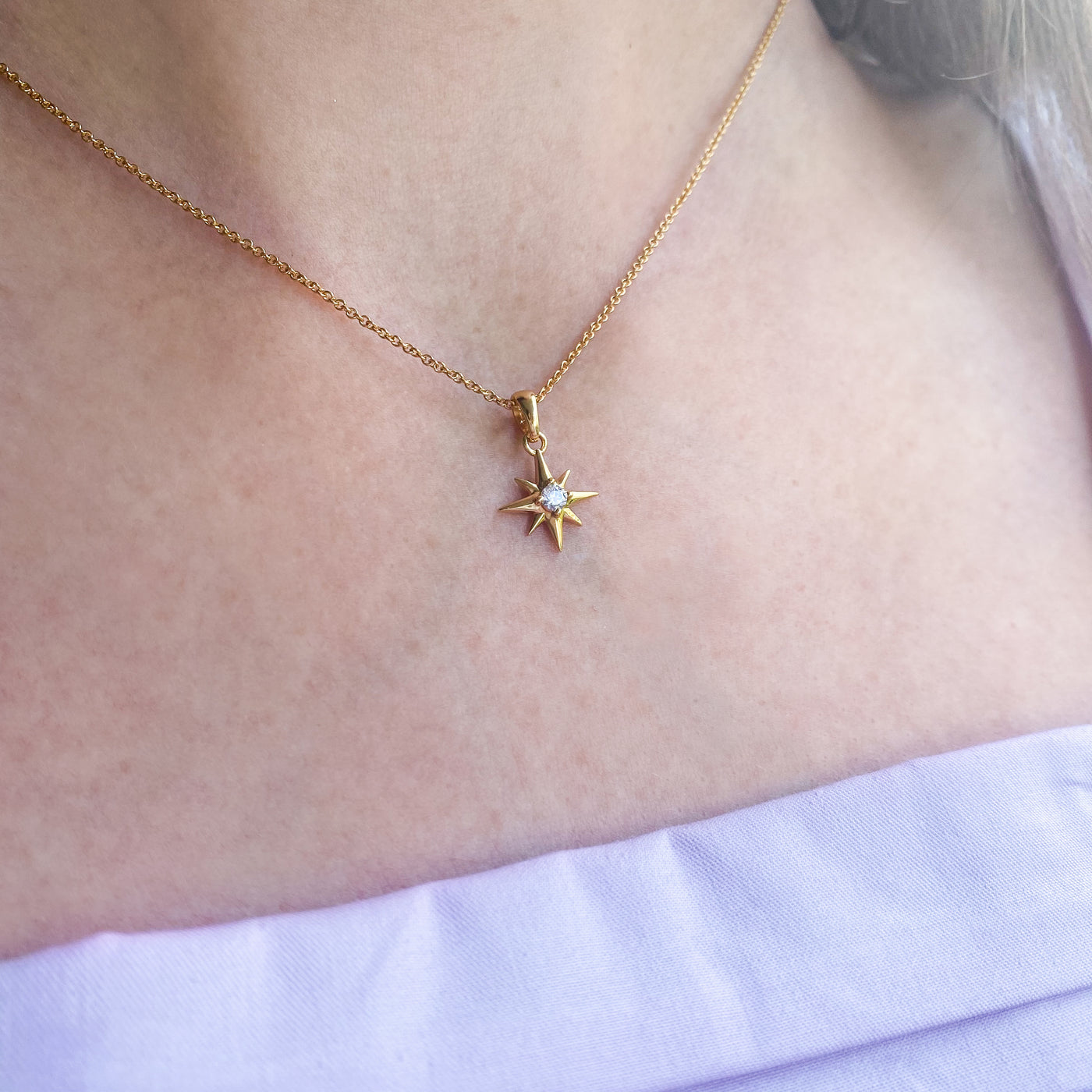 Gold star necklace with CZ crystal