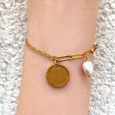 Model wearing gold plated sterling silver coin and freshwater pearl bracelet 