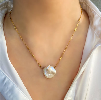 Model wearing gold plated sterling silver freshwater pearl necklace