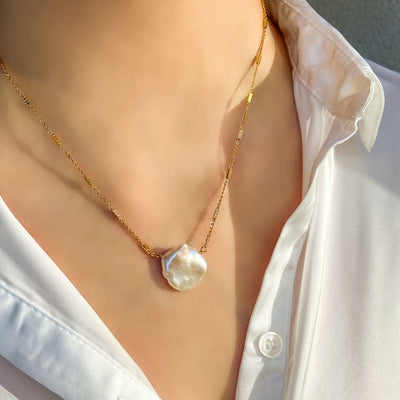 Model wearing gold plated sterling silver freshwater pearl necklace