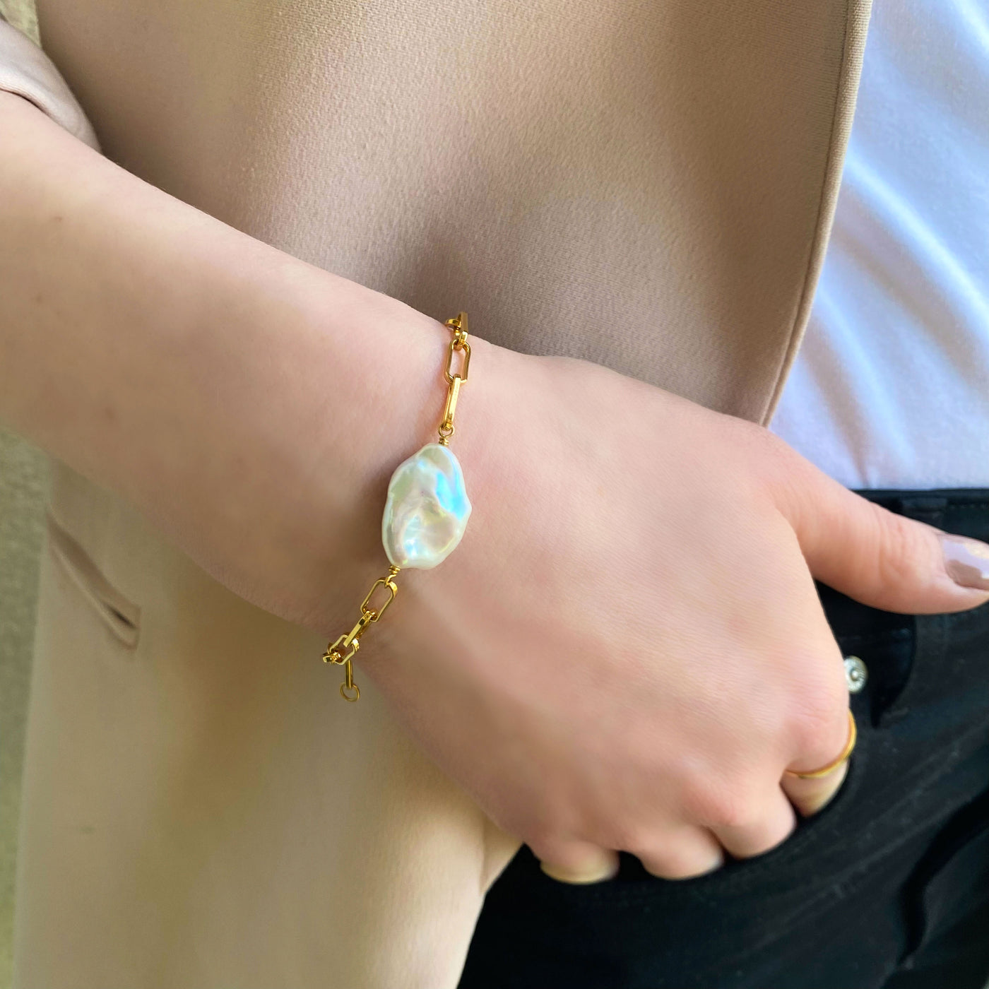 Model wearing gold plated sterling silver freshwater pearl chain link bracelet