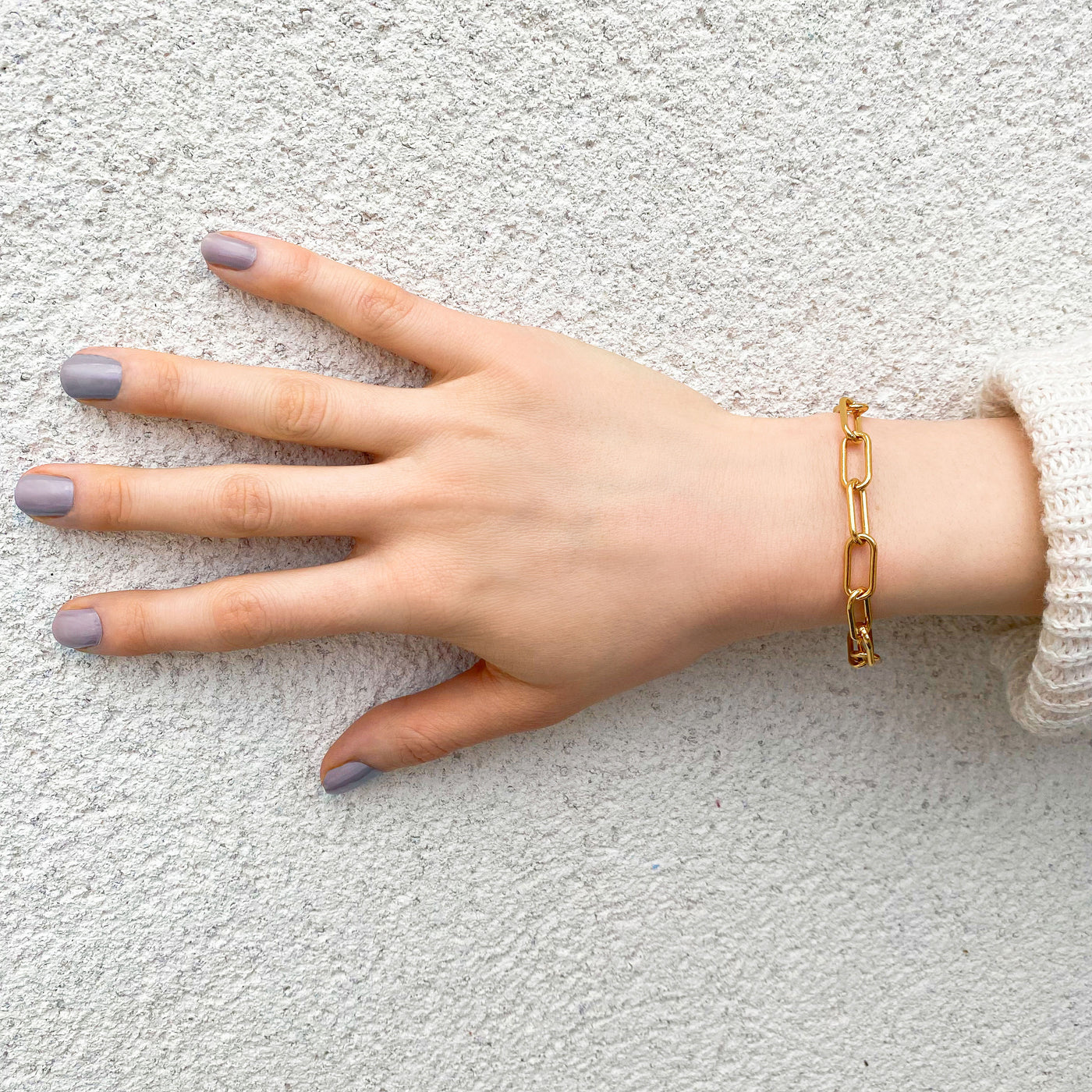 Model wearing gold plated sterling silver chunky chain bracelet
