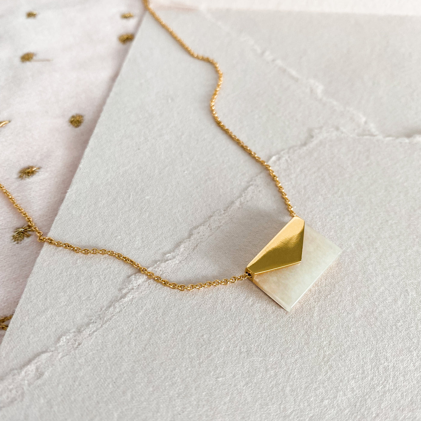 Gold envelope necklace with moonstone